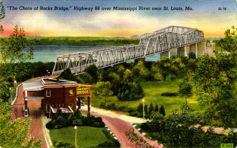 A vintage color postcard of a long steel truss bridge over a wide river, with a brick toll house and gas station in the foreground, captioned The Chain of Rocks Bridge, Highway 66 over Mississippi River near St. Louis