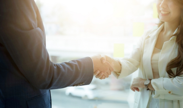 Two people shaking hands.